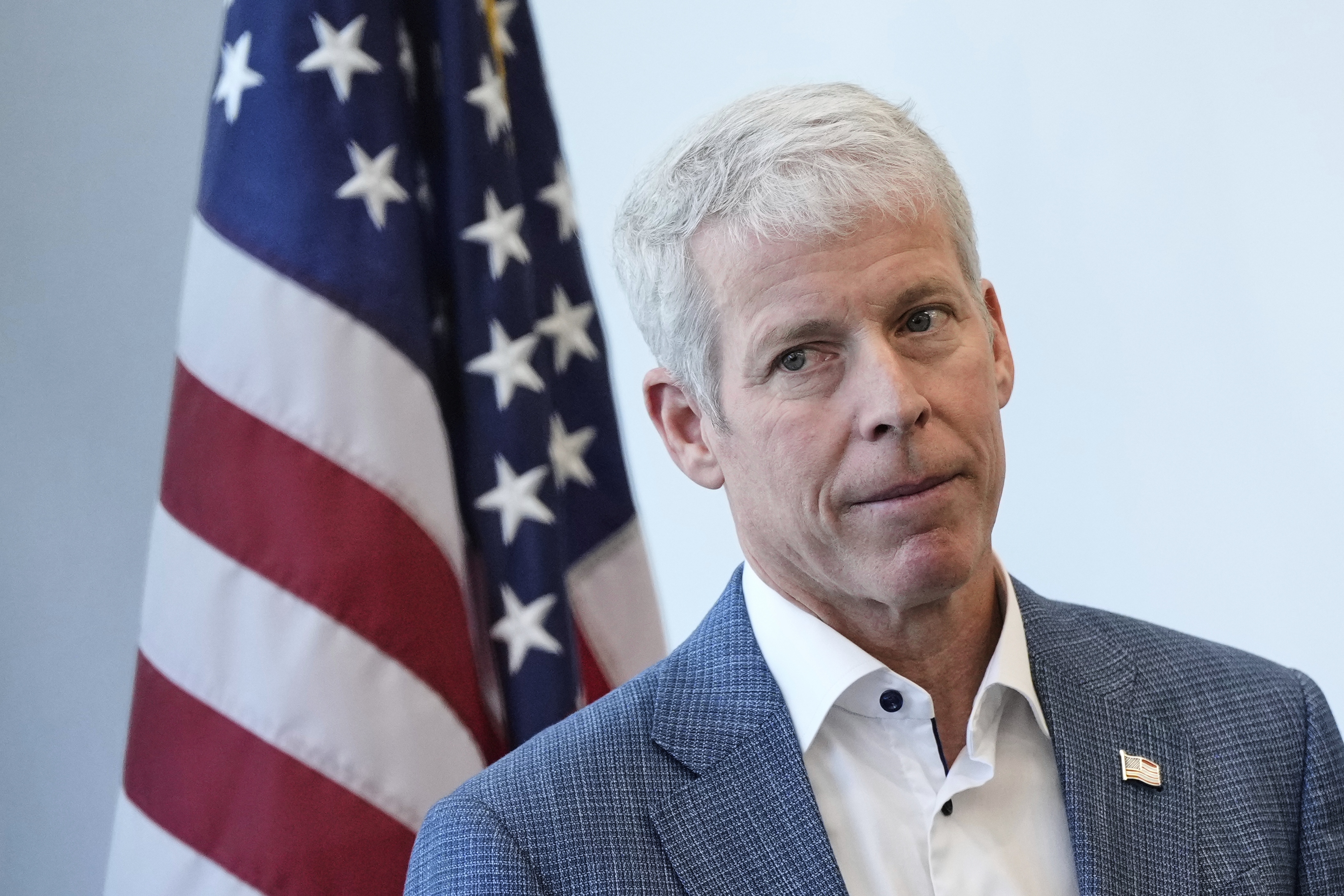 Secretary of Energy Chris Wright listens during a press conference this spring at Lawrence Berkeley National Laboratory in California.